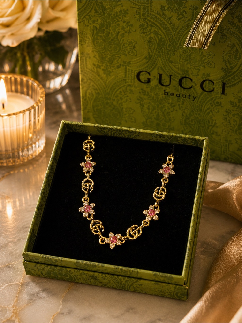 Gold Toned GG Bracelet with Pink Crystal Flowers
